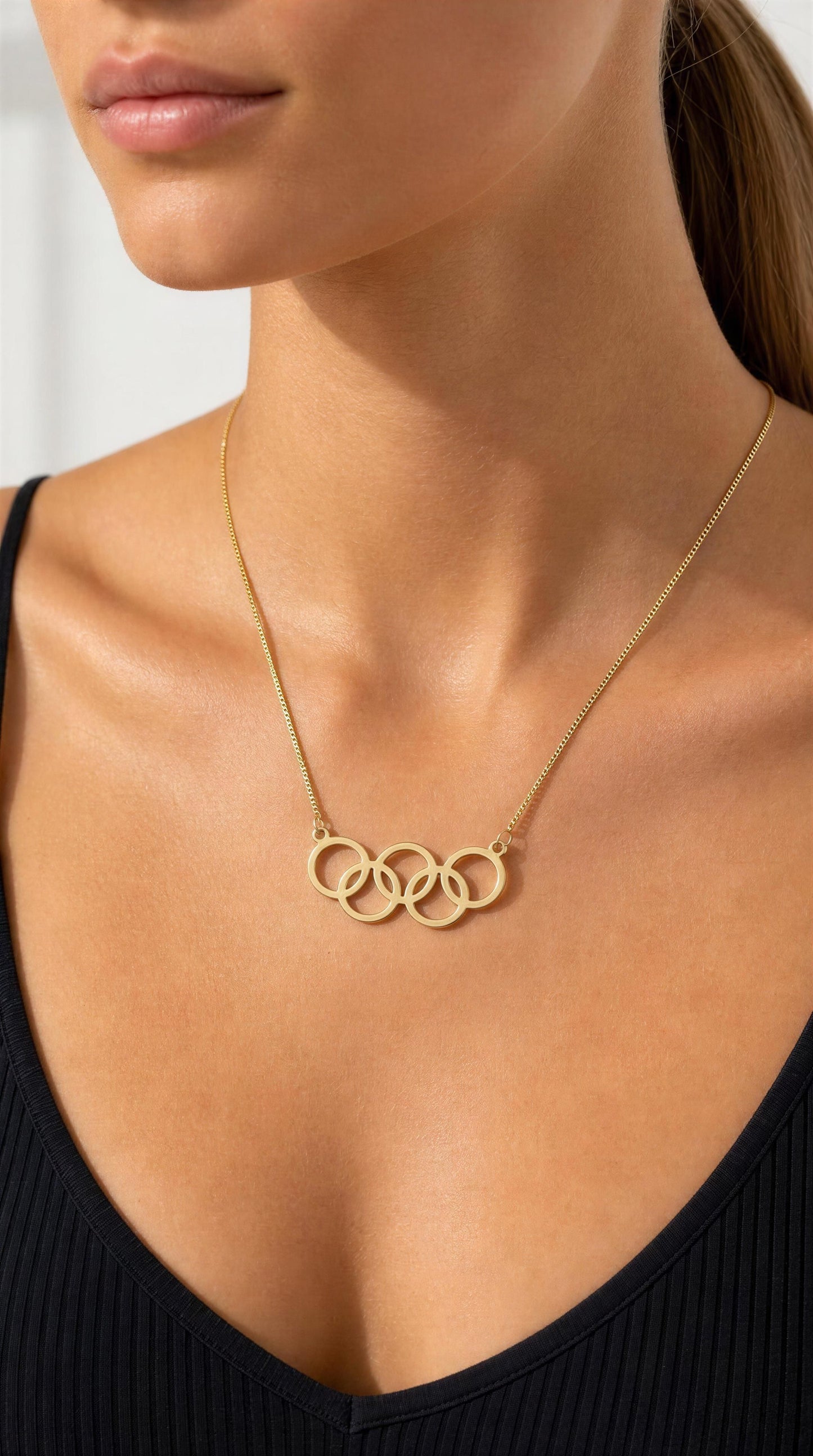colar dourado de aros olímpicos